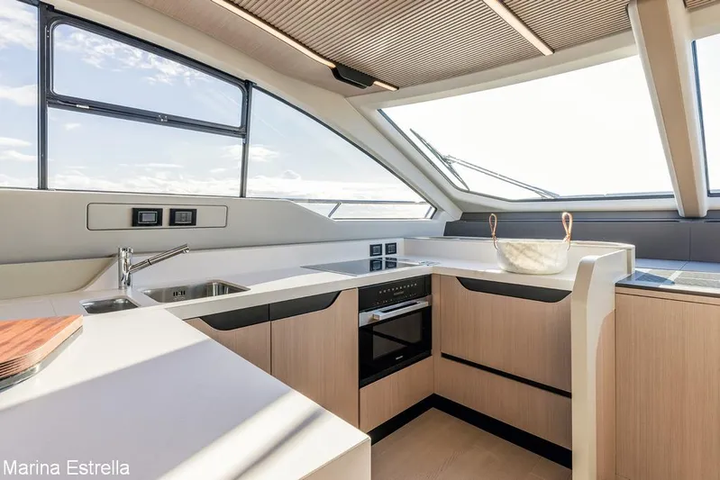  Yacht Photos Pics Modern kitchen interior of 2025 Azimut S7 yacht with sleek design and ample natural light.