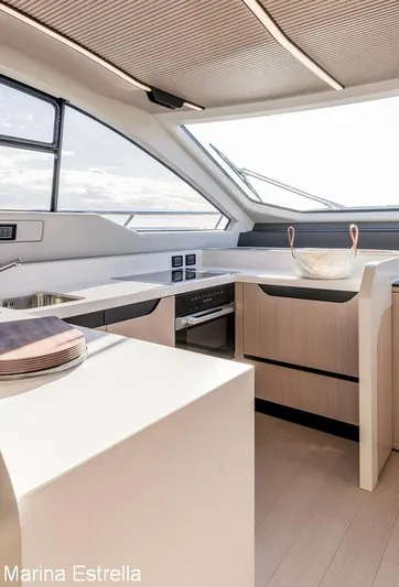  Yacht Photos Pics Modern kitchen interior of 2025 Azimut S7 yacht with sleek design and ample natural light.
