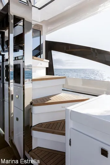  Yacht Photos Pics Interior view of 2025 Azimut S7 yacht with modern staircase and ocean backdrop.