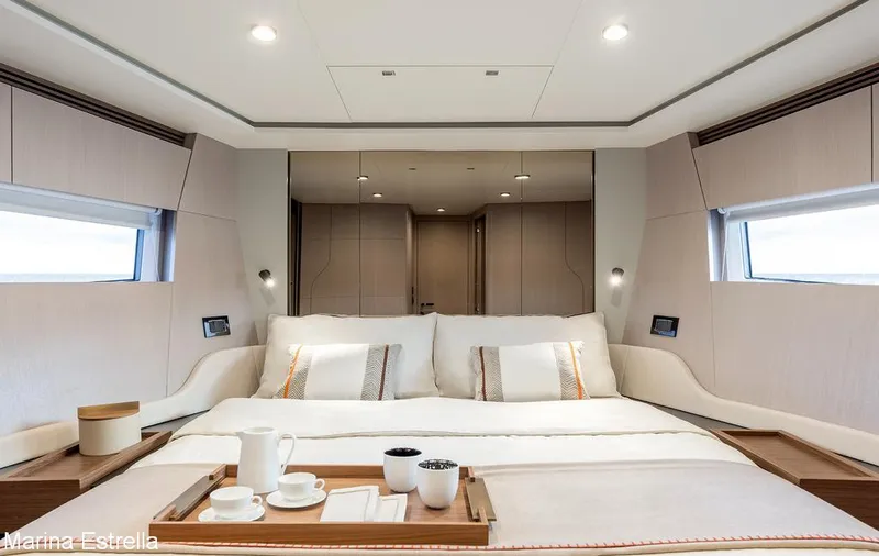  Yacht Photos Pics Luxurious bedroom interior of 2025 Azimut S7 yacht with elegant bedding and modern design.