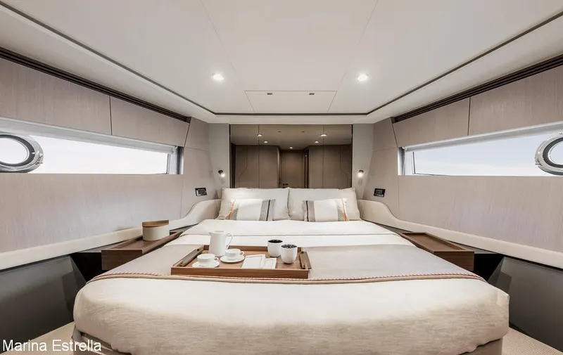  Yacht Photos Pics Luxurious bedroom interior of 2025 Azimut S7 yacht with elegant decor and natural light.