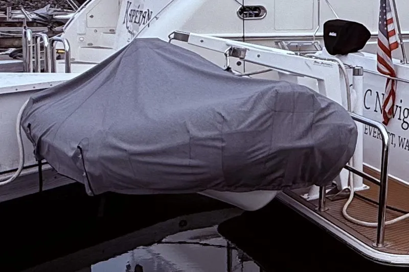  Yacht Photos Pics Covered boat on a 2007 Navigator 58 yacht, docked with American flag.