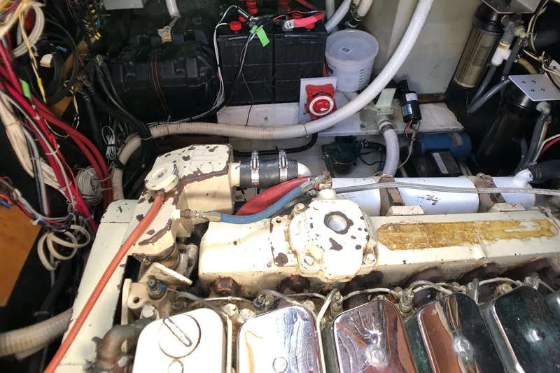  Yacht Photos Pics Engine room of a 1989 Nordic Tug 32, showcasing mechanical components and wiring.