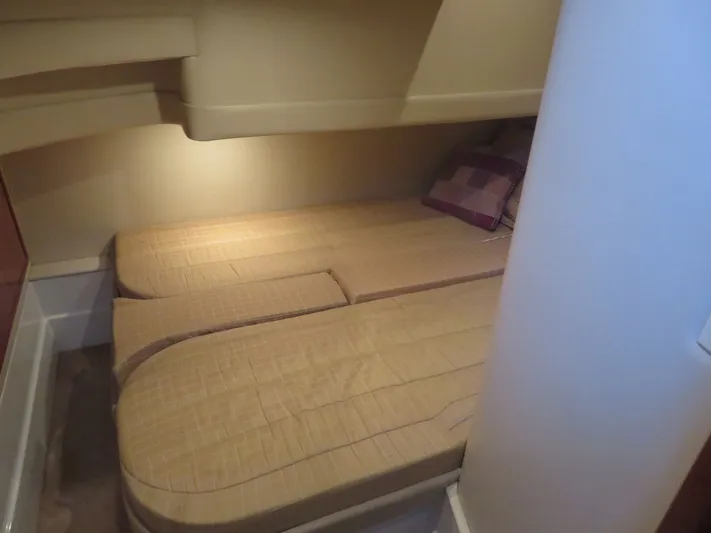 38 Special Yacht Photos Pics 2006 Carver 38 Super Sport cabin interior with twin beds and soft lighting.
