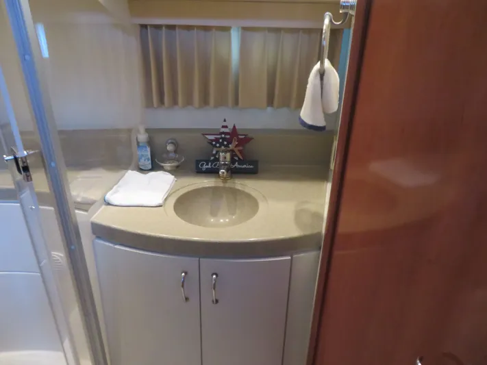 38 Special Yacht Photos Pics Bathroom interior of 2006 Carver 38 Super Sport yacht, featuring sink and towel.