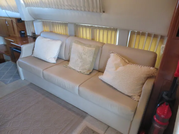 38 Special Yacht Photos Pics Luxurious interior of 2006 Carver 38 Super Sport yacht with beige sofa and cushions.