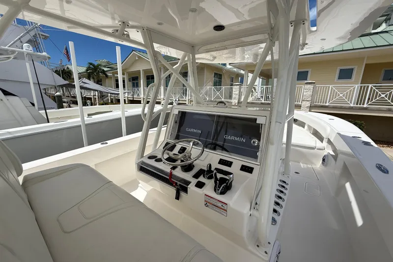  Yacht Photos Pics 2024 SeaVee 390Z boat interior with Garmin navigation system and modern helm design.