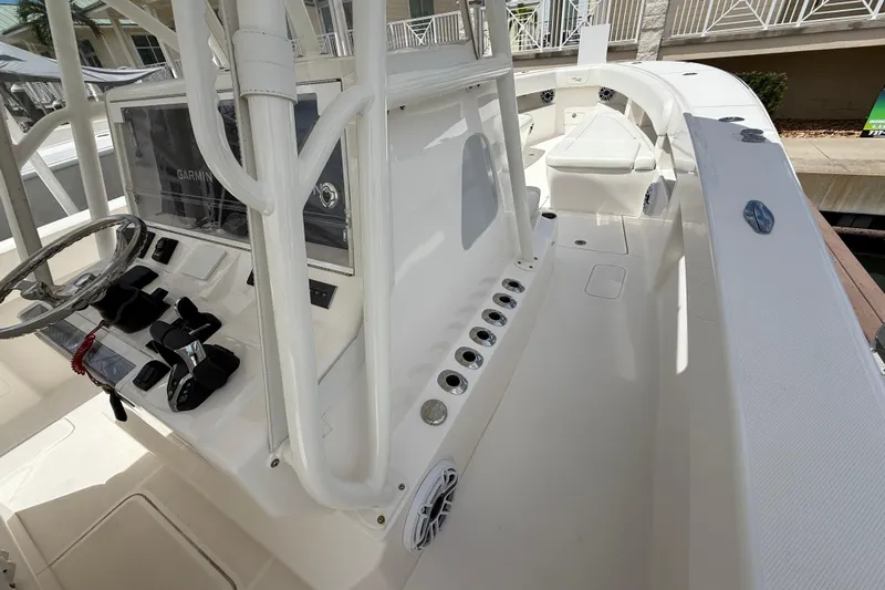  Yacht Photos Pics 2024 SeaVee 390Z boat interior with steering wheel, controls, and seating area.