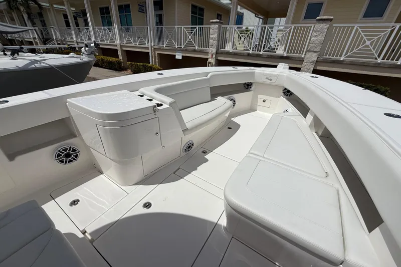  Yacht Photos Pics 2024 SeaVee 390Z boat interior with white seating and storage compartments.