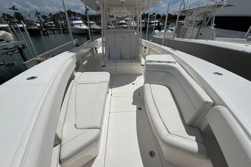  Yacht Photos Pics 2024 SeaVee 390Z boat interior with white seating, docked at marina.
