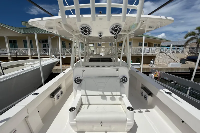  Yacht Photos Pics 2024 SeaVee 390Z boat interior with seating and speakers, docked at marina.