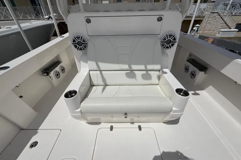  Yacht Photos Pics 2024 SeaVee 390Z boat interior with white seating, cup holders, and speakers.
