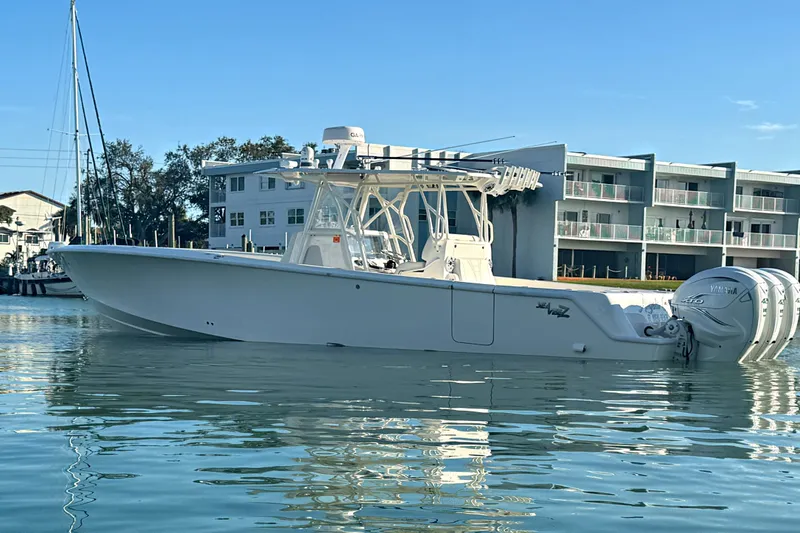  Yacht Photos Pics 2024 SeaVee 390Z boat on calm water, featuring triple Yamaha engines.