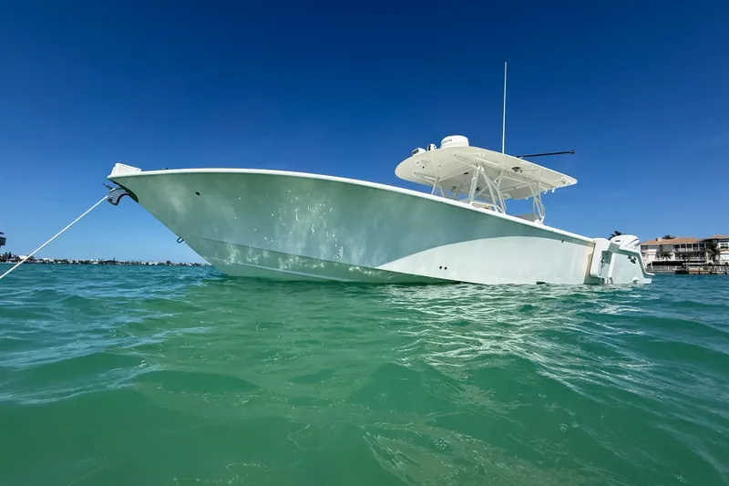  Yacht Photos Pics 2024 SeaVee 390Z boat on clear water under blue sky.