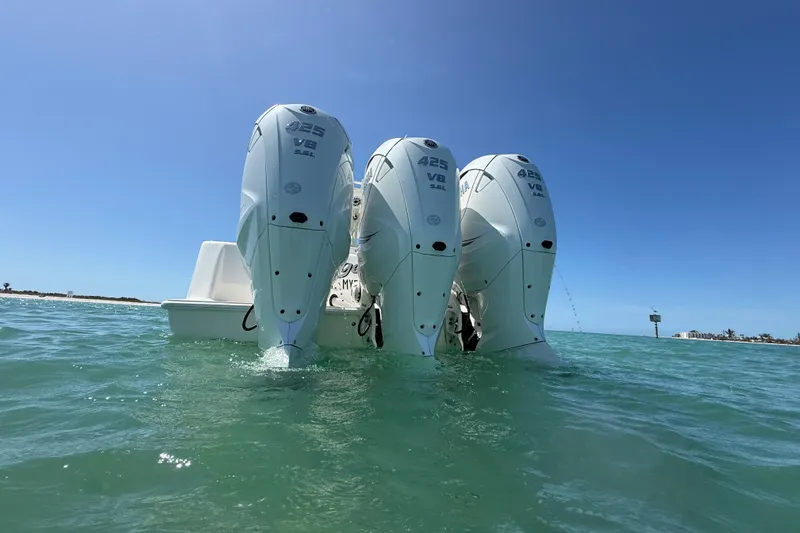  Yacht Photos Pics 2024 SeaVee 390Z boat with triple 425 V8 engines in clear blue water.