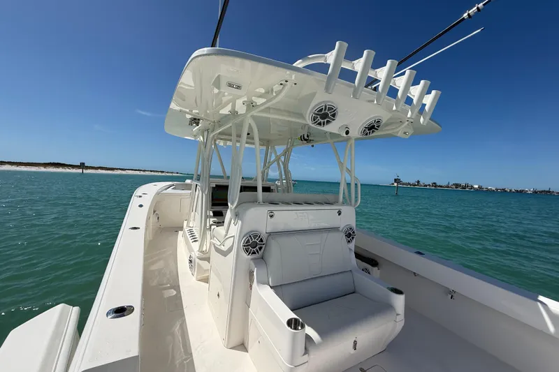  Yacht Photos Pics 2024 SeaVee 390Z boat on clear blue water, featuring spacious deck and modern design.