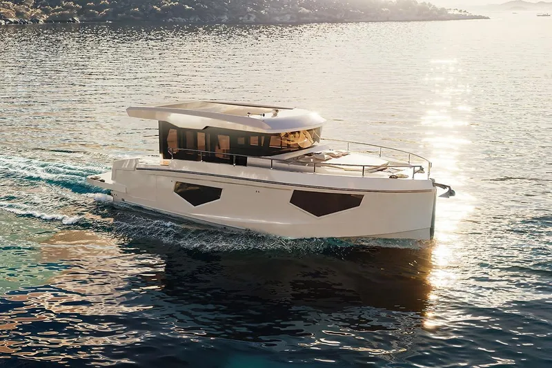 Sea Master Yacht Photos Pics 2025 Cobra Sea Master yacht cruising on serene waters at sunset.