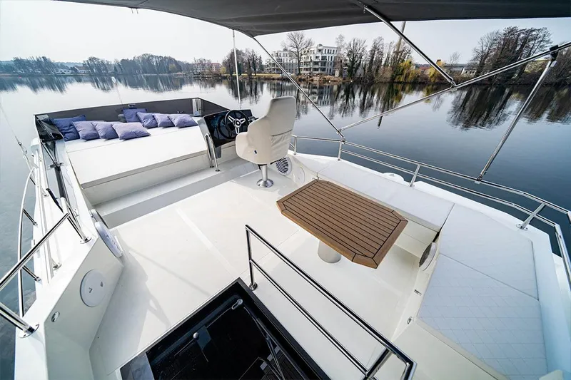 Sea Master Yacht Photos Pics Luxurious 2025 Cobra Sea Master yacht with spacious deck and elegant seating on calm waters.