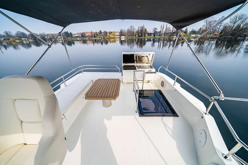 Sea Master Yacht Photos Pics Luxury deck of 2025 Cobra Sea Master yacht with scenic lake view.