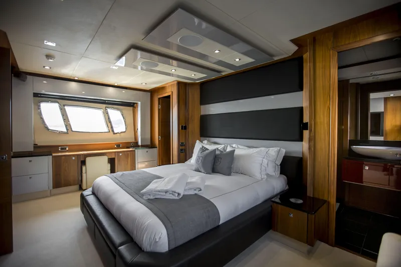P'ocean Yacht Photos Pics Luxurious bedroom interior of 2009 Sunseeker Predator 84 yacht with modern design elements.