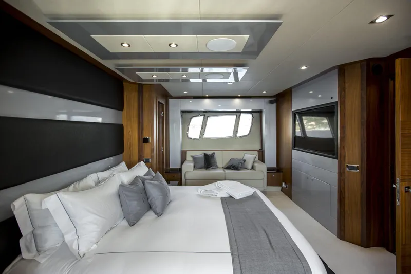 P'ocean Yacht Photos Pics Luxurious bedroom interior of 2009 Sunseeker Predator 84 yacht with modern design elements.
