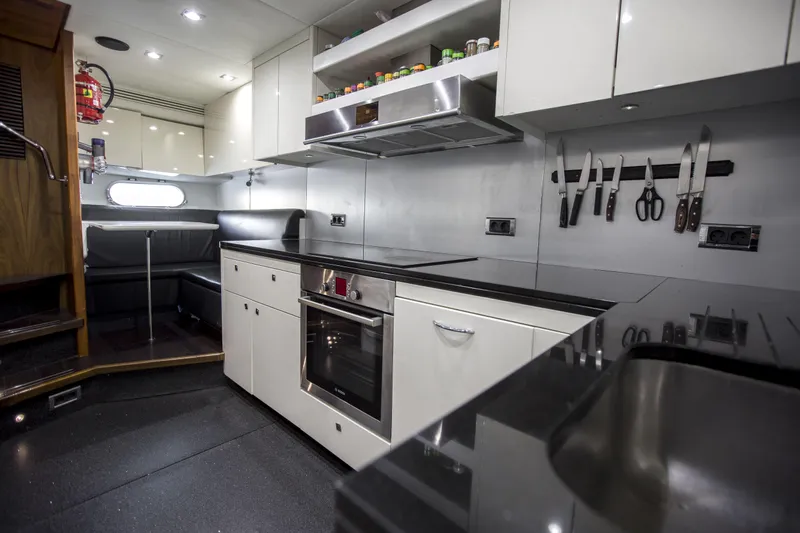 P'ocean Yacht Photos Pics Luxurious kitchen interior of 2009 Sunseeker Predator 84 yacht with modern appliances.