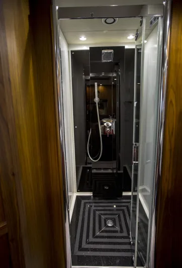 P'ocean Yacht Photos Pics Luxurious shower in 2009 Sunseeker Predator 84 yacht, featuring sleek modern design.