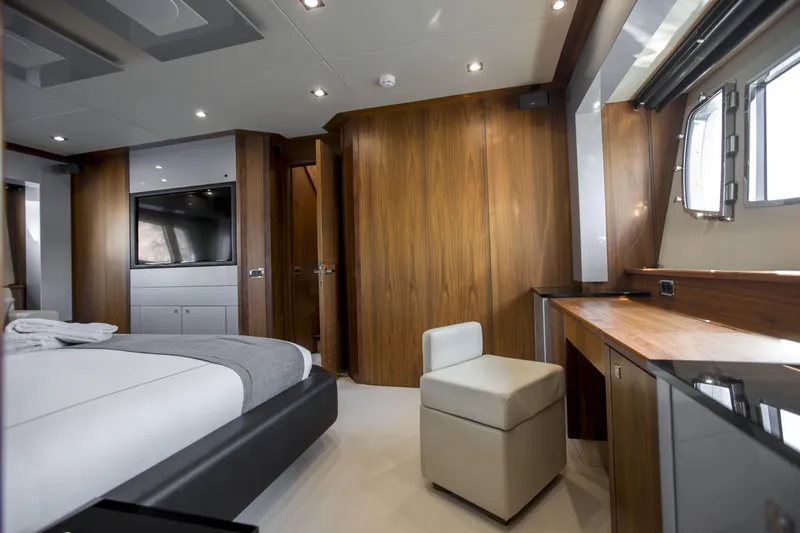 P'ocean Yacht Photos Pics Luxurious cabin interior of 2009 Sunseeker Predator 84 yacht with modern furnishings.