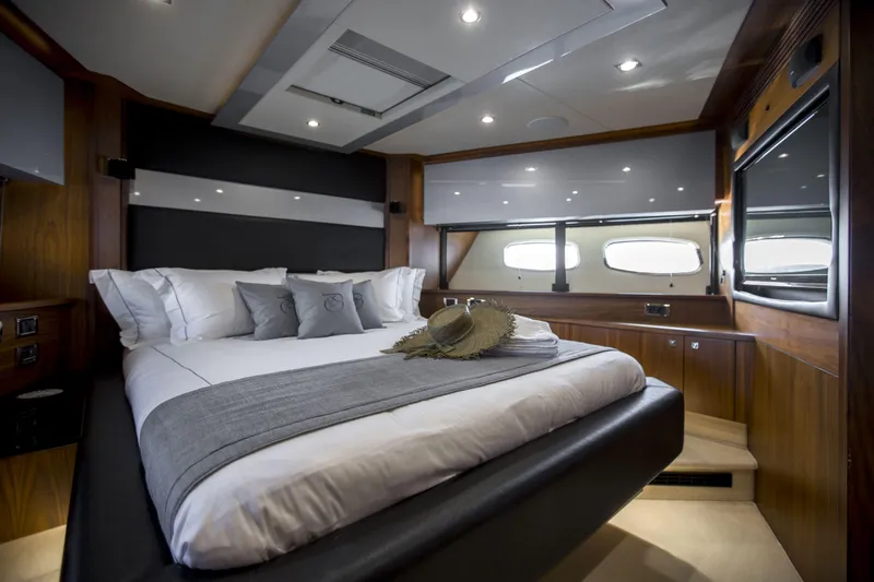 P'ocean Yacht Photos Pics Luxurious bedroom interior of 2009 Sunseeker Predator 84 yacht with elegant bedding.