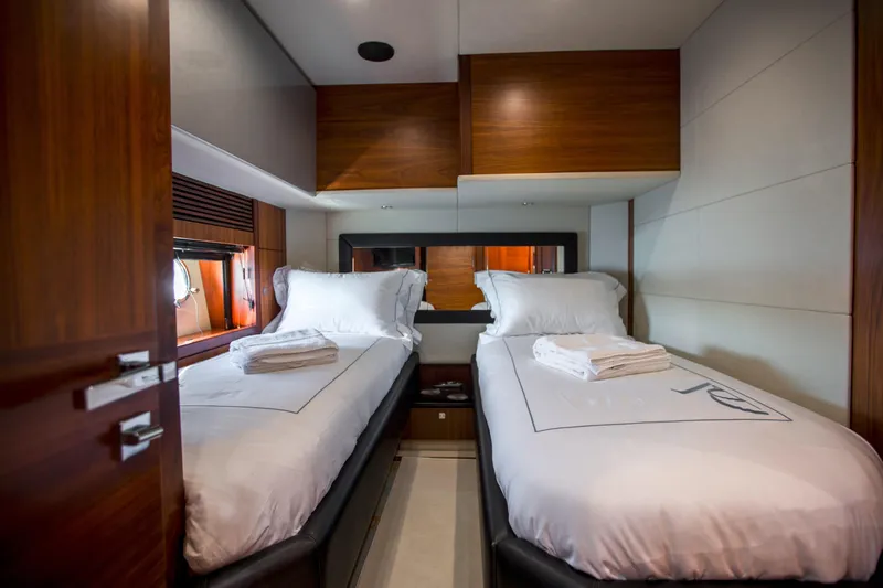 P'ocean Yacht Photos Pics Twin cabin interior of 2009 Sunseeker Predator 84 yacht with modern wood finishes.