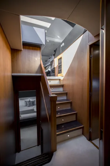 P'ocean Yacht Photos Pics Interior of 2009 Sunseeker Predator 84 yacht, featuring wooden stairs and modern design.