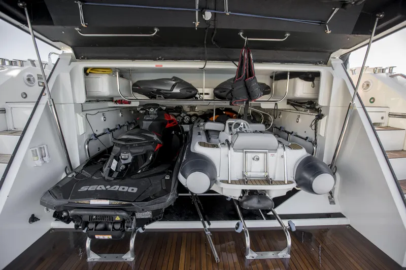 P'ocean Yacht Photos Pics Storage area of 2009 Sunseeker Predator 84 with jet ski and inflatable boat.