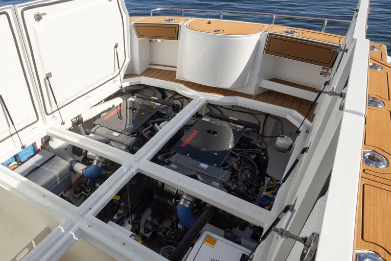  Yacht Photos Pics Engine compartment of 2025 Ocean Sport Roamer boat, showcasing dual engines and spacious design.