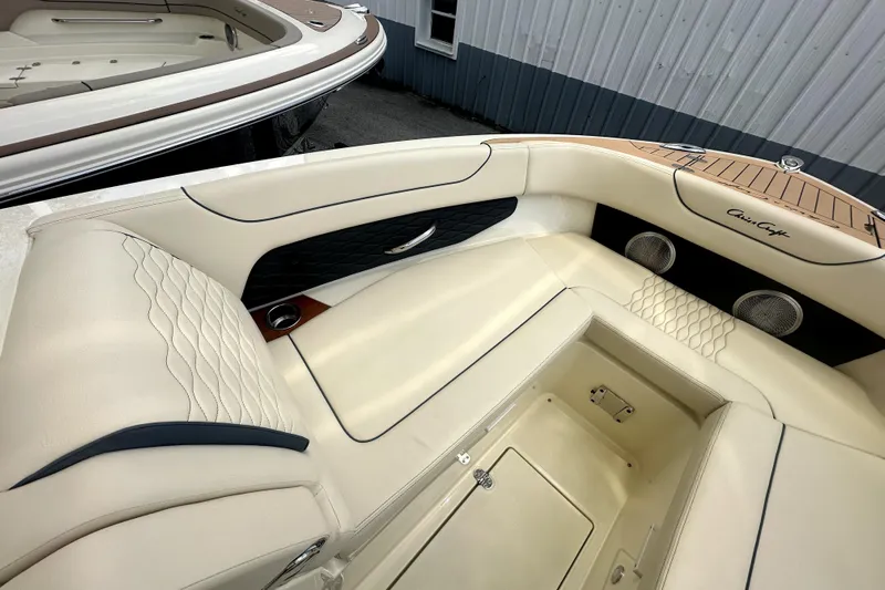  Yacht Photos Pics Luxurious interior of 2026 Chris-Craft Sportster 28 boat with elegant seating and speakers.