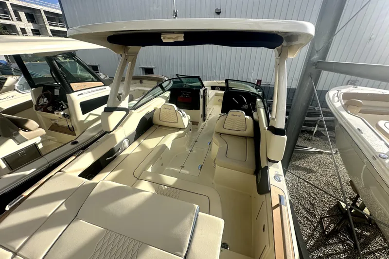  Yacht Photos Pics 2026 Chris-Craft Sportster 28 boat interior with beige seating and modern design.