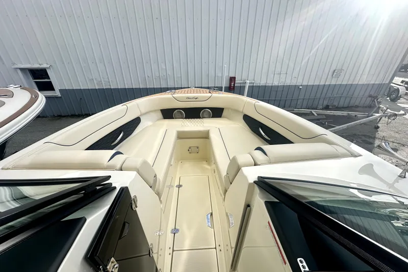  Yacht Photos Pics 2026 Chris-Craft Sportster 28 boat interior with beige seating and sleek design.
