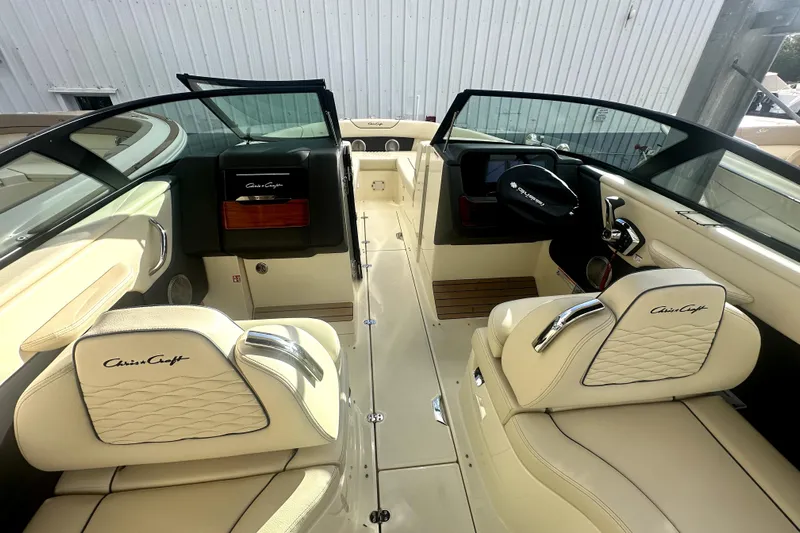  Yacht Photos Pics 2026 Chris-Craft Sportster 28 interior with luxurious cream seating and sleek dashboard design.