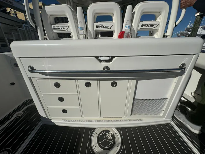  Yacht Photos Pics 2012 Boston Whaler 370 Outrage interior with storage compartments and seating.