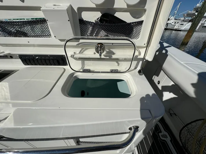  Yacht Photos Pics Boston Whaler 370 Outrage 2012 boat interior with open storage compartment.