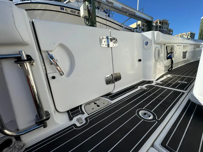  Yacht Photos Pics 2012 Boston Whaler 370 Outrage boat deck with sleek design and modern fittings.