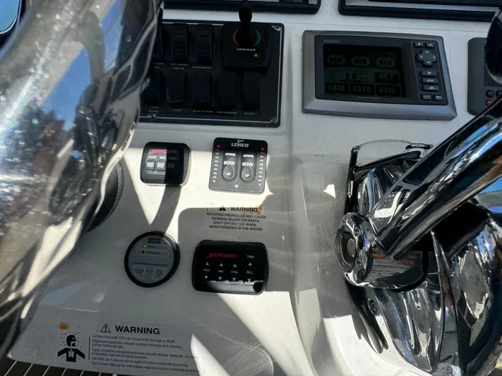  Yacht Photos Pics Control panel of a 2012 Boston Whaler 370 Outrage boat with various instruments.
