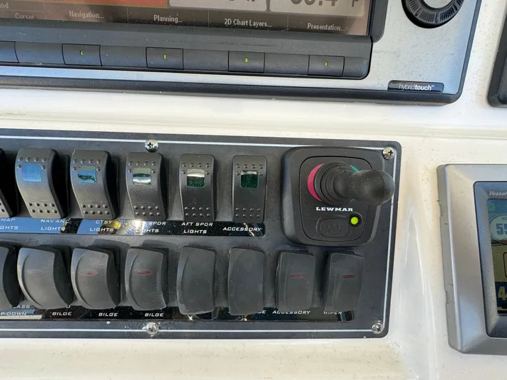  Yacht Photos Pics Control panel of a 2012 Boston Whaler 370 Outrage boat with switches and joystick.