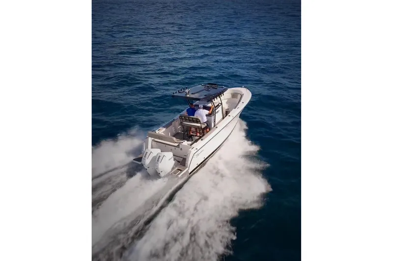  Yacht Photos Pics 2026 SeaWell 290CC boat cruising on open ocean waters.