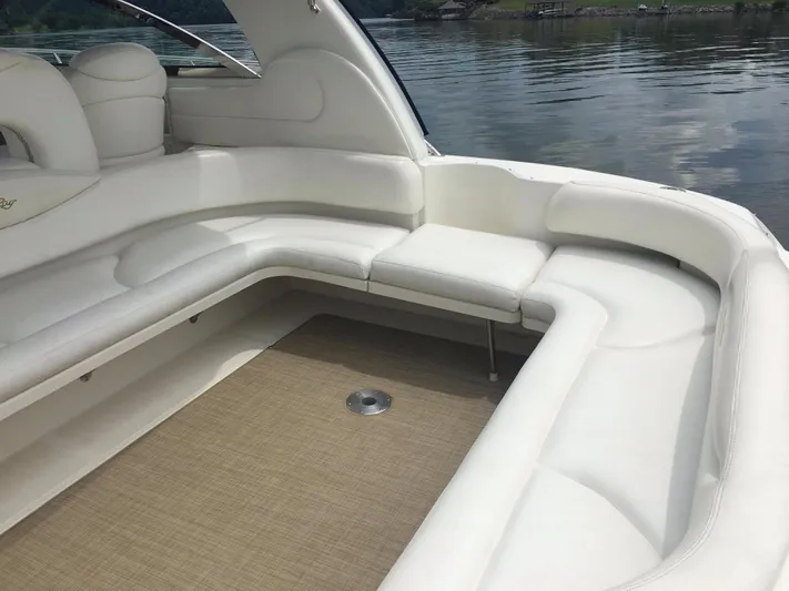  Yacht Photos Pics Luxurious seating area on a 2000 Sea Ray 410 Sundancer yacht, featuring white upholstery.