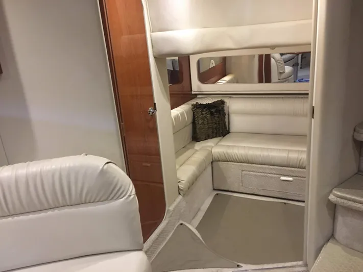  Yacht Photos Pics Interior of 2000 Sea Ray 410 Sundancer with white leather seating and wood accents.
