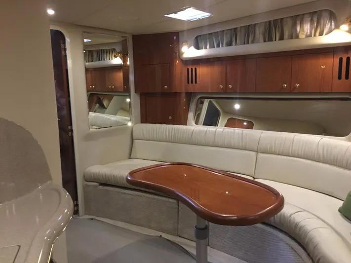 Yacht Photos Pics Luxurious interior of 2000 Sea Ray 410 Sundancer yacht with elegant seating and wooden accents.