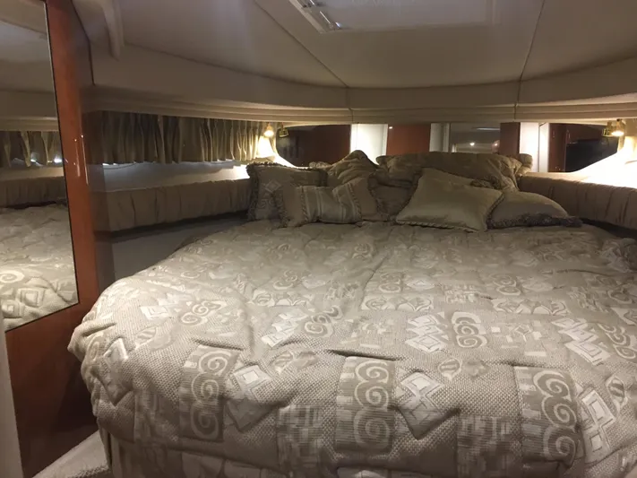  Yacht Photos Pics Luxurious cabin interior of 2000 Sea Ray 410 Sundancer yacht with plush bedding.