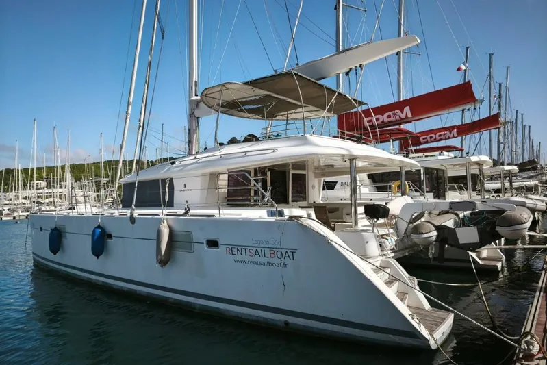  Yacht Photos Pics 2012 Lagoon 560 catamaran docked at marina, available for rent.