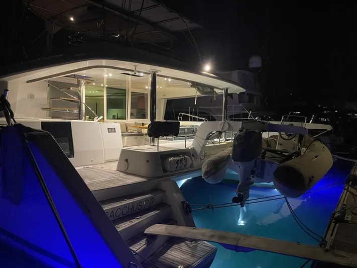  Yacht Photos Pics Lagoon 560 yacht, 2012 model, illuminated at night with blue underwater lights.