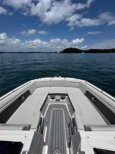  Yacht Photos Pics 2020 Sea Ray 290SDX boat on calm water under a partly cloudy sky.